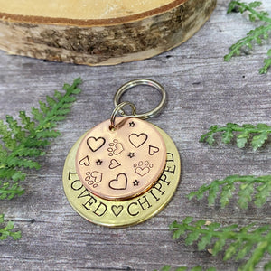 copper and brass dog tag